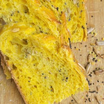 Alpha Turmeric Seeded Sourdough Bread first slice