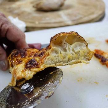 Judith Pizza first slice